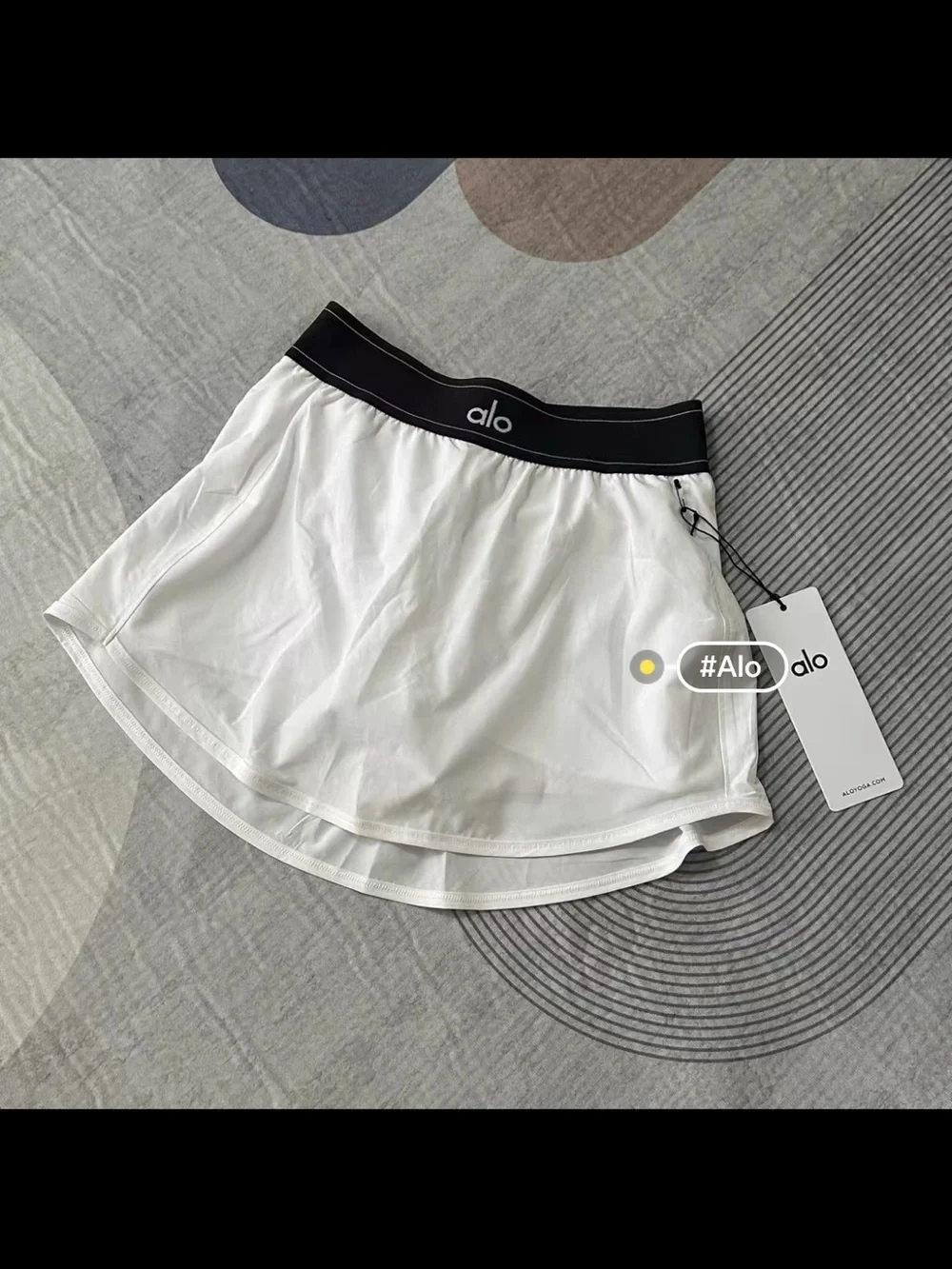 ALO Yoga White Tennis Skirt with Black Elastic Waistband